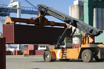 large forklift-truck moving container