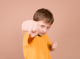 young boy showing off his fist