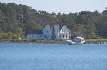 Fototapeta premium seaside house and shrimp boat