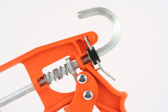 orange caulking gun