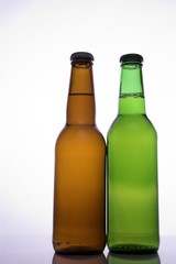 two beer bottles with no labels