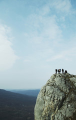 people on the cliff