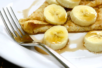 Delicious crepe with banana and honey