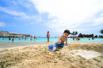 building sandcastle with my sister.