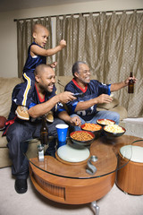african-american family watching tv.