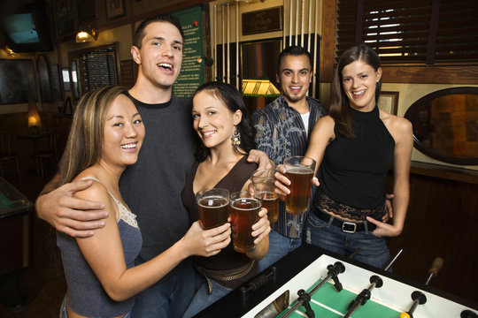 group of young adults at bar.