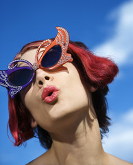 adult female wearing unique glasses.