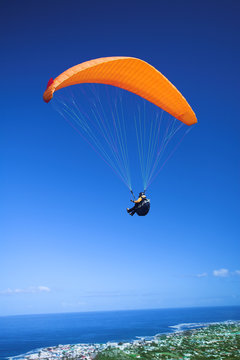 paraglider launching from the mountain ridge