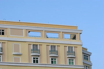 yellow condo and blue sky