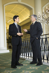 two businessmen in hotel.