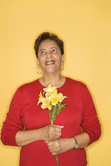 woman holding flowers.