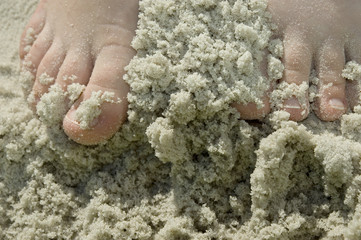 kids feet in sandy beach fun