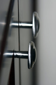 silver knobs on black background