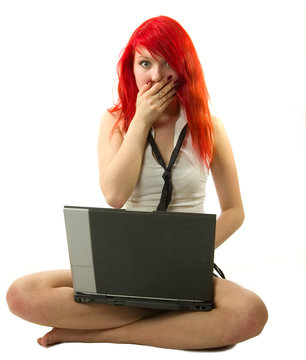 surprised girl with notebook computer sitting
