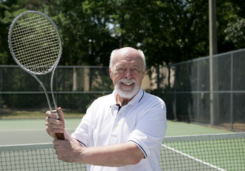 senior man plays tennis © Lisa F. Young