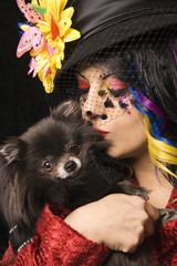 Portrait of unique Caucasian woman with Pomeranian dog.