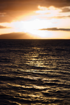 Sunset view of ocean in Maui, Hawaii.