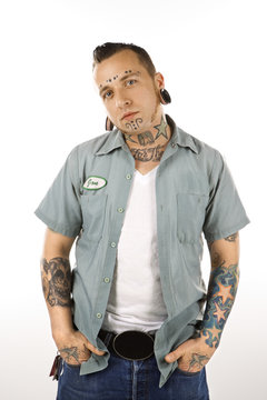 Adult Male With Tattoos And Piercings.