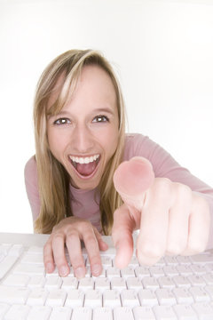 laughing teenage girl using computer