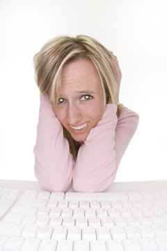 frustrated teenage girl using computer