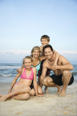Fototapeta na wymiar Portrait of family at beach.