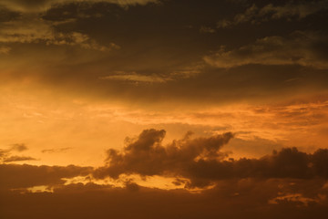 Fototapeta na wymiar Golden sunset sky and clouds.