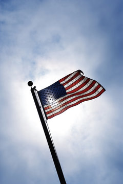 American flag blowing in breeze.