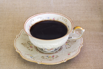 antique cup with hot coffee