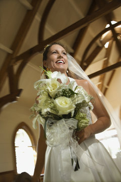 Bride holding bouquet.