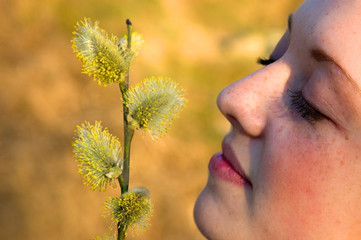 girl smelling allergic flower