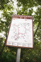 Sign with map showing routes.