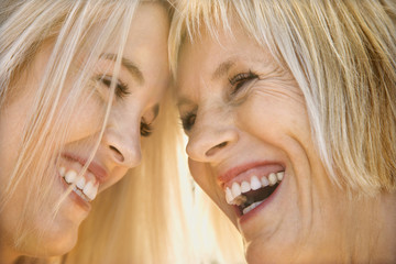 Mom and daughter laughing.