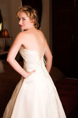 young blonde bride wearing wedding gown