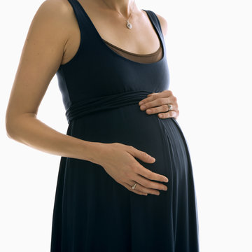 pregnant woman with hands on belly.