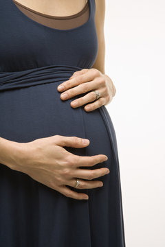 pregnant woman with hands on belly.