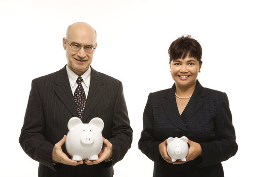 businesspeople holding piggybanks.