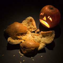 jack-o'-lantern with smashed pumpkin.