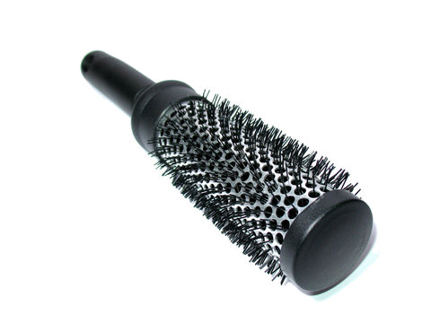 round black hairbrush isolated on white.