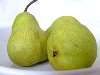 white plates with fruit - pears on white