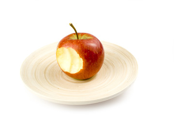 Fototapeta na wymiar nibbled stripped apples on white background