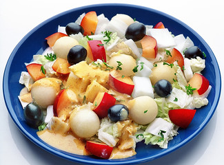 vegetable salad with olives and plums