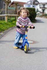 girl on her scooter