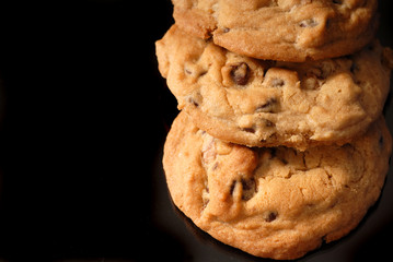 closeup of three chocolate chip cookies