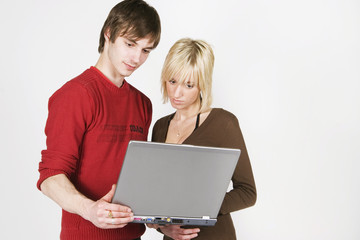 young couple and notebook