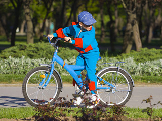 Naklejka premium little boy on his bicycle