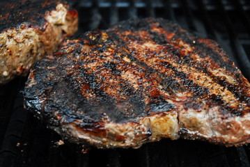 porterhouse steaks on grill