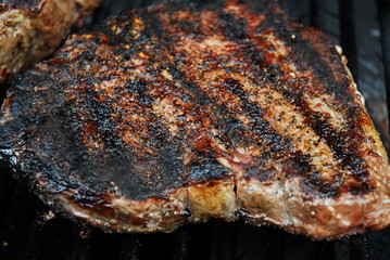 porterhouse steaks on grill