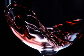 closeup of red wine pouring - obrazy, fototapety, plakaty