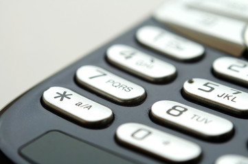Fototapeta premium close up shot of mobile keypad under light