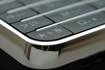 close up shot of mobile keypad under light